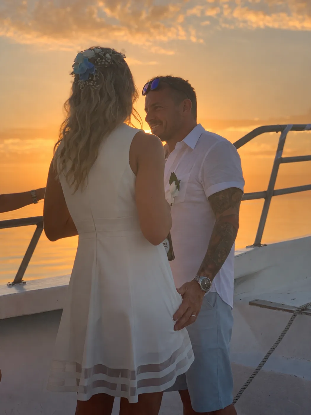 Newlyweds on the boat deck at sunset in Key West