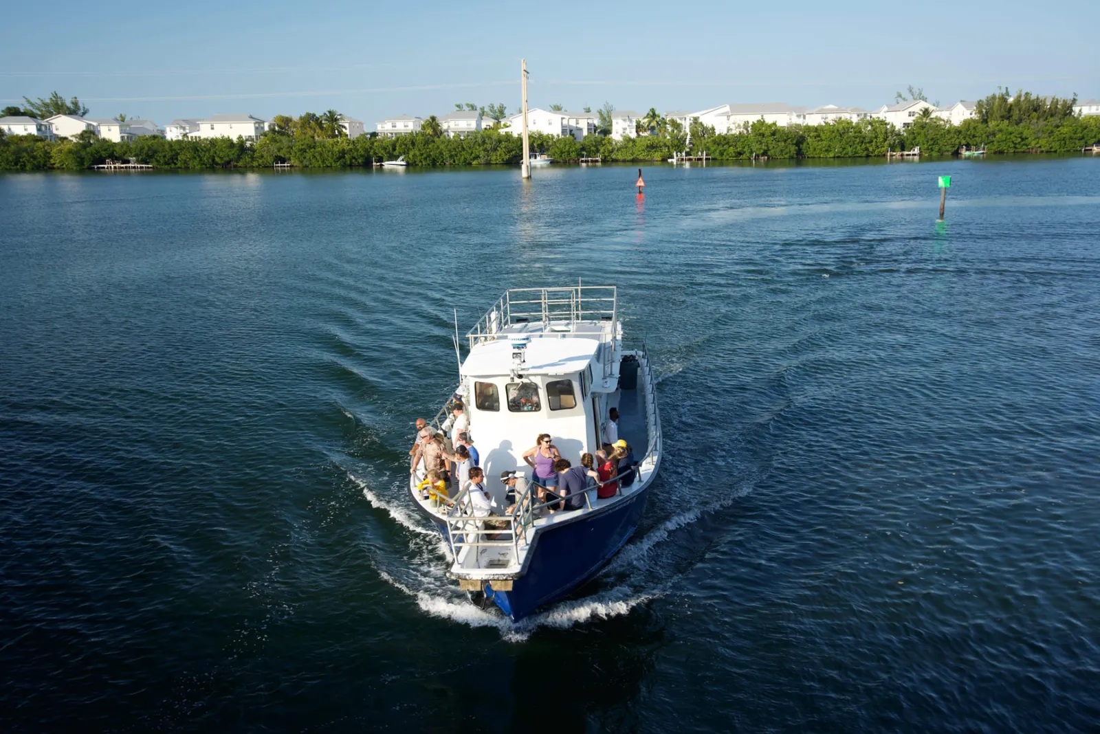 Gulfstream IV party boat returning through Key West channel with guests aboard